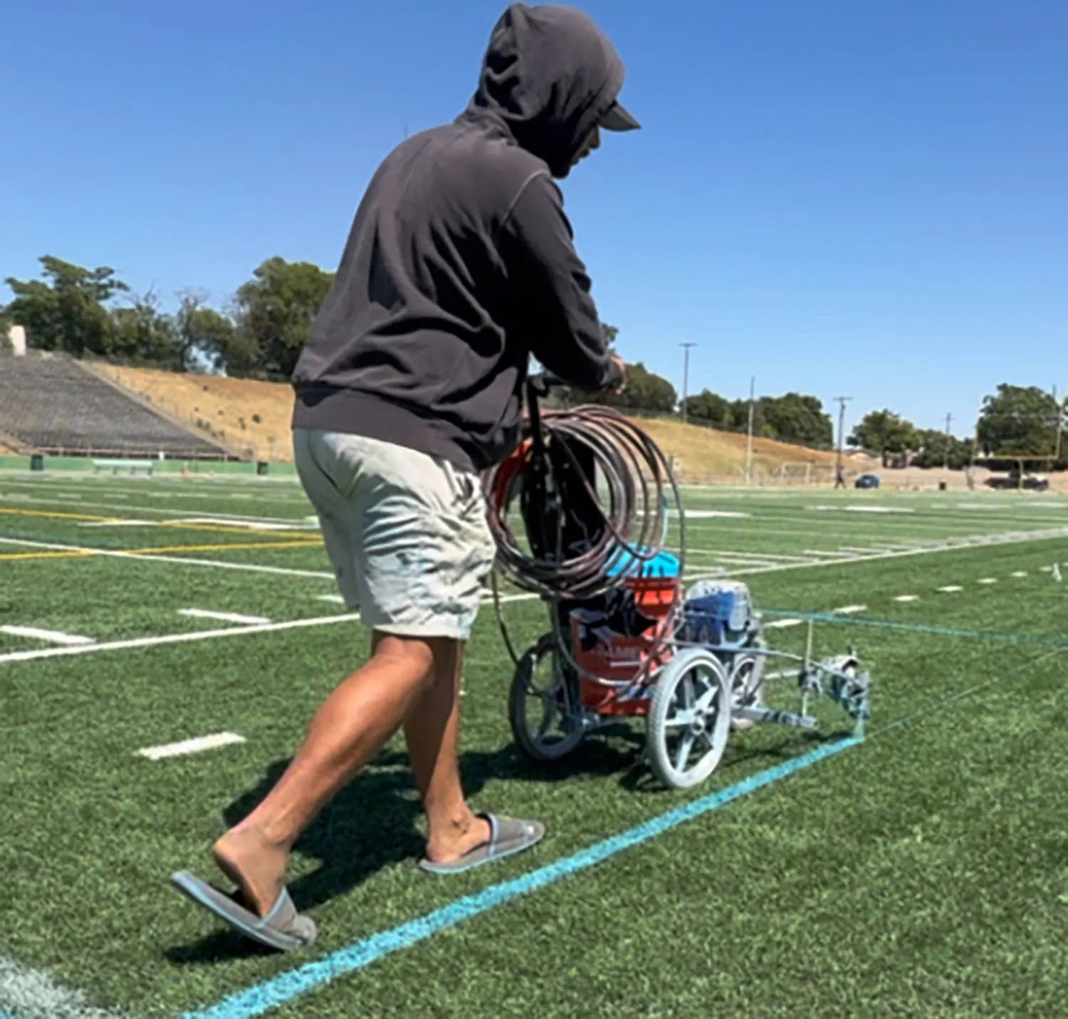 Jordan-Achay-sprays-NFL-Fields-04-110325-a609a91c36d2479eb09ba6dc7ea54bde